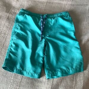 Kids size 8 Johnnie-O blue-green swim trunks good condition